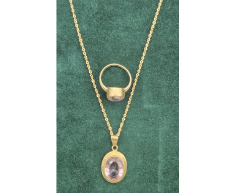 9ct yellow gold necklace together with a 9ct yellow gold and amethyst gem stone pendant. 9ct yellow gold and Amethyst gem sto