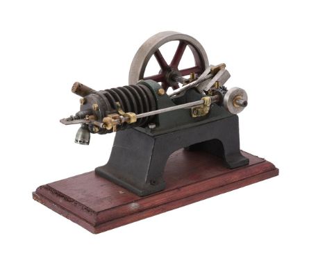 A small period air cooled side rod stationary engine, with open crank flanked by cylinder and mounted flywheel. From the coll