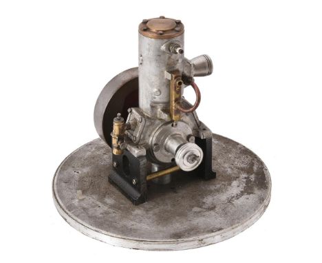 A small well engineered model of a 'Hubbard' vertical single cylinder internal combustion engine, with disc flywheel. Engine 