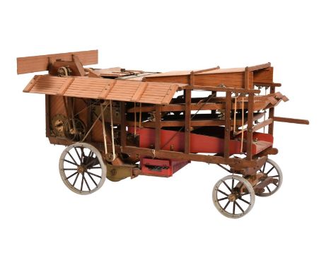 An exhibition standard of approximately 2 inch scale model of an agricultural threshing machine, the model with full internal