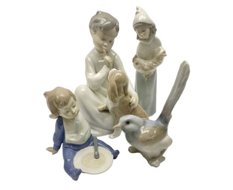 Three Lladro figures, comprising Bird no 1054, Shepherdess with rooster no 4677 and Boy with Dog no 4522, together with a Nao