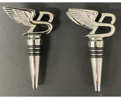 Two Bentley silver plate wine stoppers