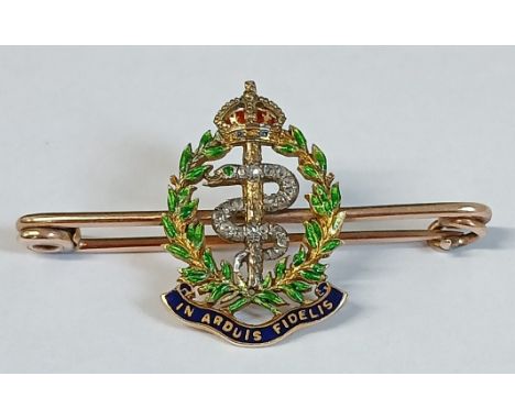 Royal Army Medical Corp tested as 9ct gold bar brooch with central diamond set serpent and enamel decoration (possibly higher