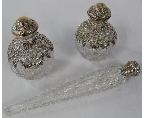 Two matching "grenade shape" silver on hobnail cut glass scent bottles Birmingham 1906 14cm complete with stoppers, and 1 dag