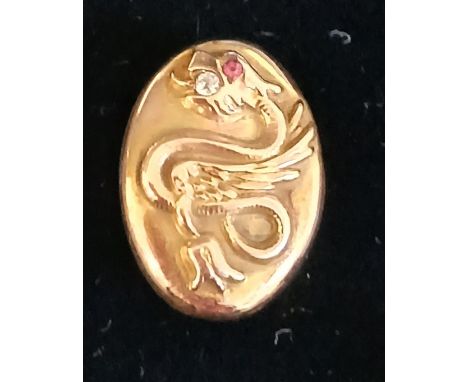Tested as 9ct gold napkin clip with raised serpent decoration and inset diamond &amp; ruby, approx 20mm x 15mm, 2.9g