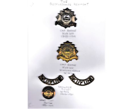Bedfordshire Regiment Cap Badges (2) in (Bi-metal and Brass) one WWI Economy variant, with a matching Shoulder Title Pair and