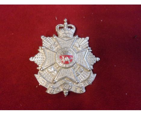 The Border Regiment EIIR Cap Badge (White-metal and red painted centre), slider and made J.R. Gaunt. K&amp;K: 1996