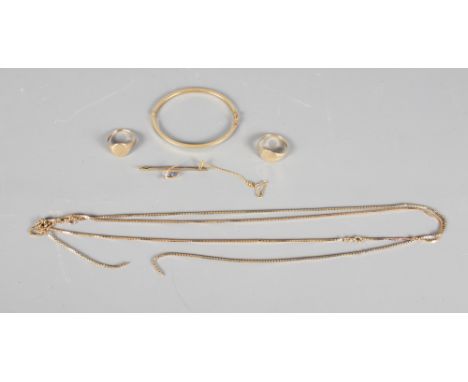 Two 9ct gold signet rings, two 9ct gold necklaces, 21.7g, a yellow metal bar brooch and a similar hinged bangle