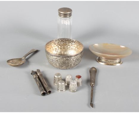 A silver caddy spoon, five silver thimbles, a silver topped jar, a sugar basin, etc