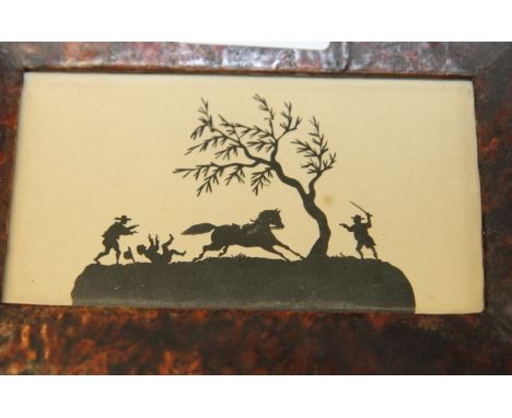 A miniature cut paper silhouette picture of figures with a runaway horse, in simulated tortoiseshell frame, and an early 20th