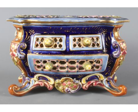 A 19th Century Zsolnay Pecs Pottery miniature chest decorated blue, pink, brown and green, 7 1/2" wide x 4 3/4" high