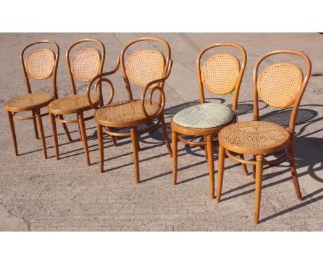 A set of five Dinette light beech framed bentwood dining chairs with caned backs and seats (4+1)