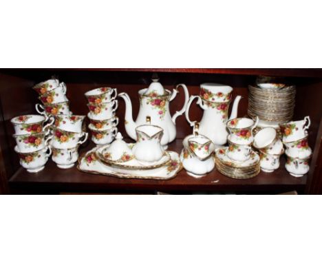 An "Old Country Roses" part combination service including teapots, coffee pots, coffee cups, saucers, dessert dishes, stands,