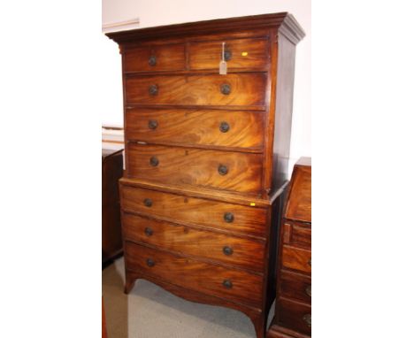 An early 19th Century mahogany chest on chest, fitted two short and six long drawers, on cut away bracket supports, 45" wide