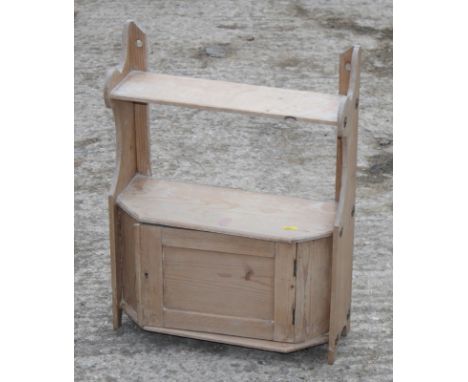 A 19th Century stripped pine wall hung medicine cabinet and a three-tier wall shelf, 17" wide