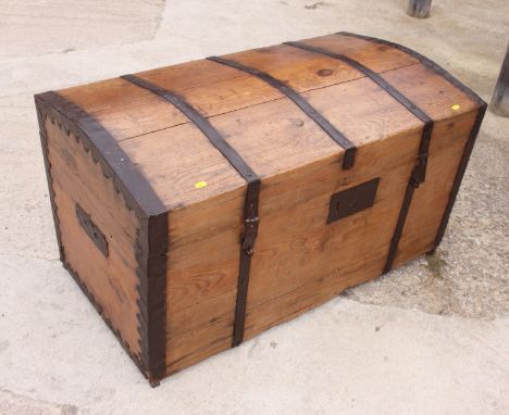 A metal bound pine dome top trunk, 43" wide