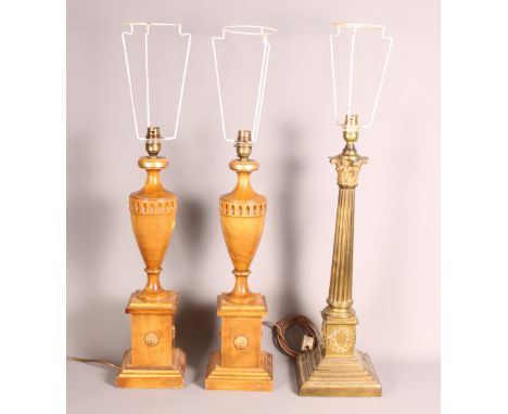 A 19th Century brass Corinthian column table lamp (now converted to electricity), and a pair of wooden table lamps