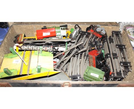 An 'O' gauge clockwork train set including a Hornby LNER 0-4-0 engine and tender, level crossings track and various items of 