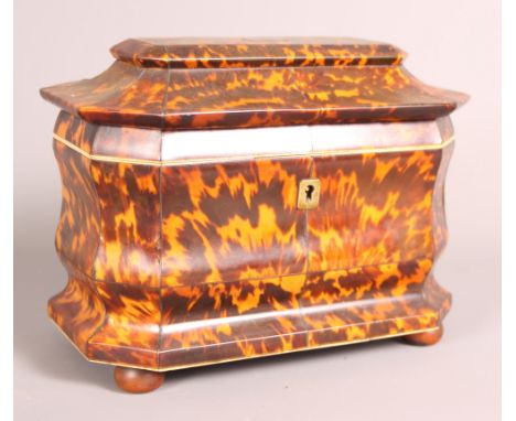 A 19th Century tortoiseshell and ivory two-compartment tea caddy, 8" wide