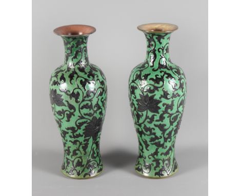 A pair of Chinese scroll decorated vases, 14'' high (both AF)