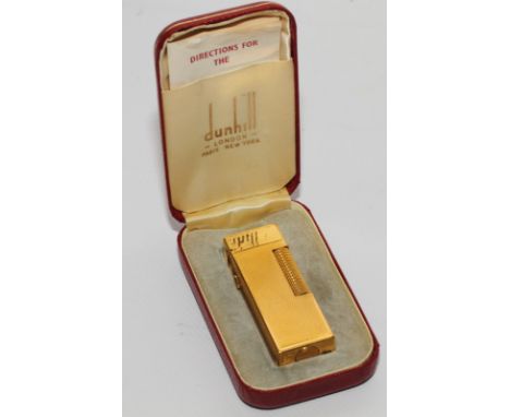 A Dunhill lighter, rolled as gold wash, in original case