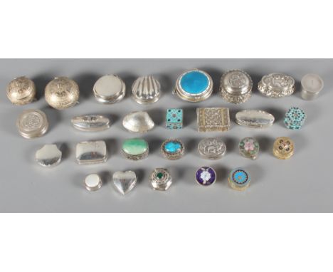 A silver and blue guilloche enamel pill box, four other silver pill boxes and twenty-two white metal pill boxes, some with en