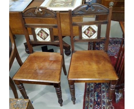 A pair of late Victorian walnut aesthetic design hall chairs, inset tile backs