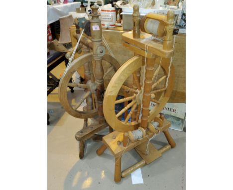 A 19th century spinning wheel reproduction spinning wheel with treadle action --&nbsp;The modern wheel looks to be complete a