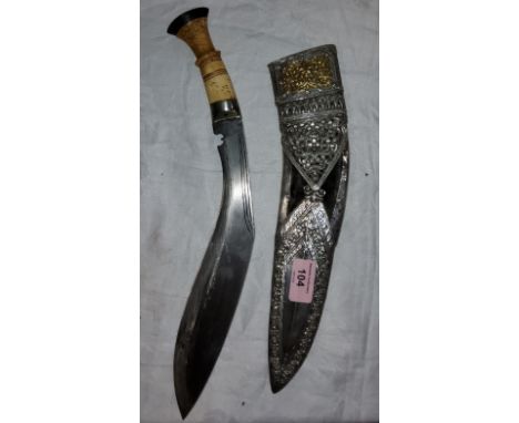 A ceremonial bone handled kukri with ornate worked white metal and yellow metal scabbard, blade length 29cm 