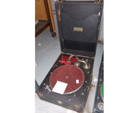 A vintage portable, table top, wind up, record player 