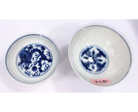 A Chinese blue and white ceramic rice bowl decorated with blossom and bamboo tree, with six character mark to base, diameter 
