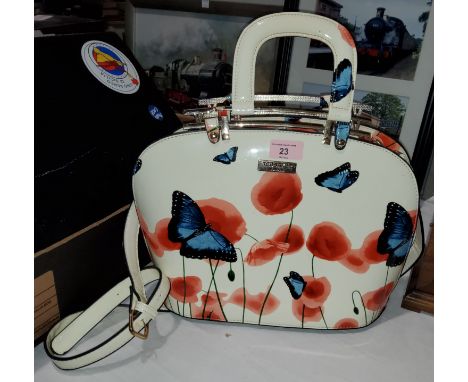 A handbag and purse bearing label 'Ted Baker' 