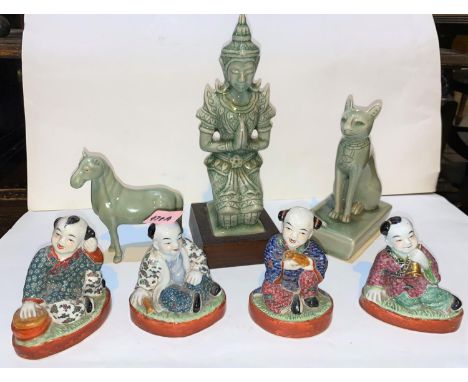 Four Chinese ceramic figures of children with musical instruments; three celadon glazed figures. All pieces in good condition