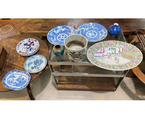 A large circular Chinese planter, a selection of plates, chargers etc.&nbsp;Both items in good condition.