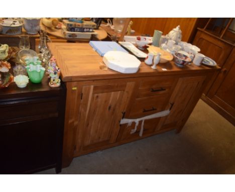 A light oak three drawer sideboard 