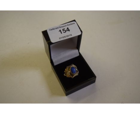 A silver and lapis lazuli set ring
