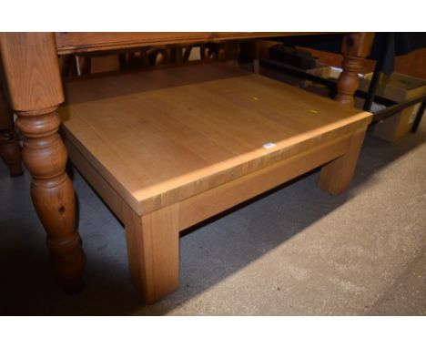 A low light oak coffee table 