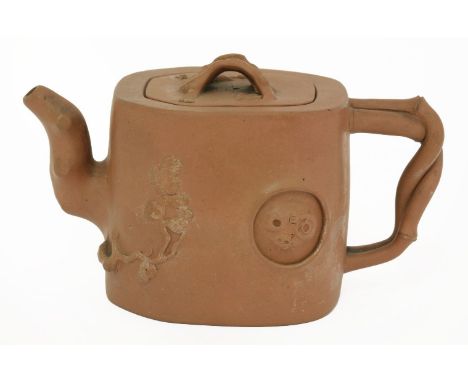 A Yixing teapot with cover, Republic period (1912-1949), modelled as a section of pine trunk with gnarled spout and bamboo ha