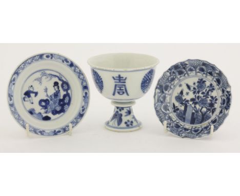 A group of blue and white,Kangxi (1662-1722), including a stem cup, with shou character, flowers and butterflies to stem, Blu