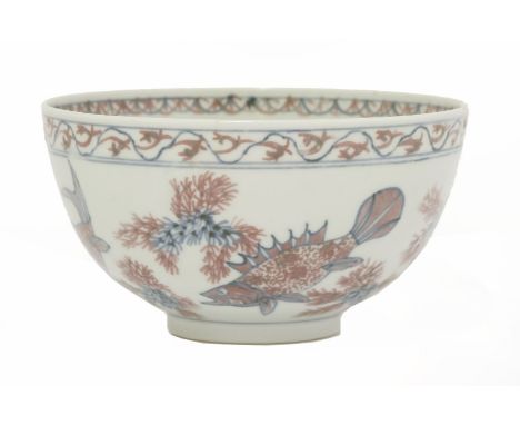 A Chinese rice bowl, Republic period (1912-1949), painted with carps amongst pond weed with underglaze blue and iron red, the