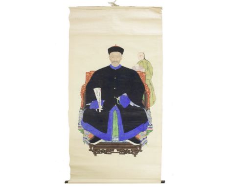 A Chinese ancestor portrait hanging scroll, early 20th century, of an elderly man seated in a black robe with an attendant be