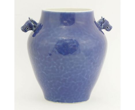 A blue ground porcelain jar, 20th century, with dog head handles, six character seal mark of Qianlong in underglaze blue, 28c