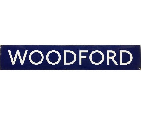 London Underground enamel STATION SIGN from Woodford on the Central Line. This is the centre bar from a platform bullseye sig