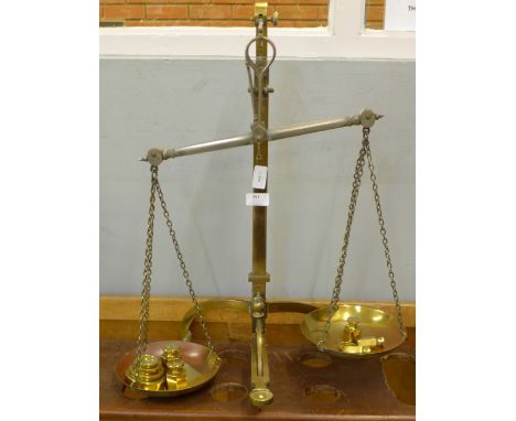 A set of brass balance scales and weights, Vandome, Titfords &amp; Pawson, London