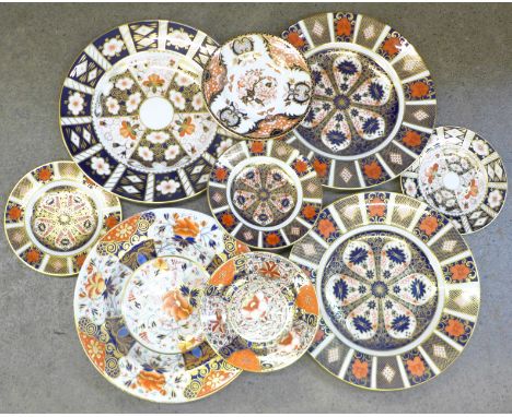 Three Royal Crown Derby Imari dinner plates, four tea plates, a Crown Derby soup bowl and tea plate