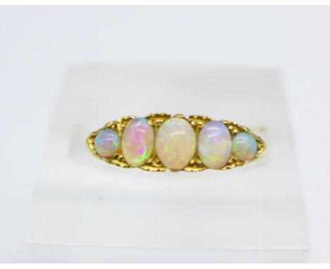 An 18ct gold and five stone opal ring, 3.3g, Q