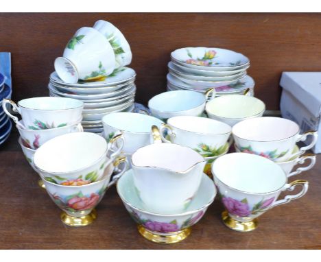 A Paragon Harry Wheatcroft 'Six World Famous Roses' part tea set, eighteen cups, side plates, seventeen saucers plus cream, s