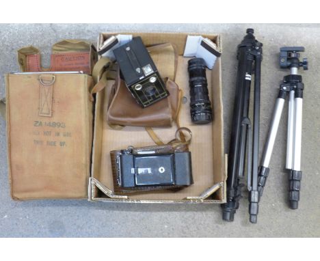 Four cameras including a folding camera, flash gun, light meter, two tripods, etc.