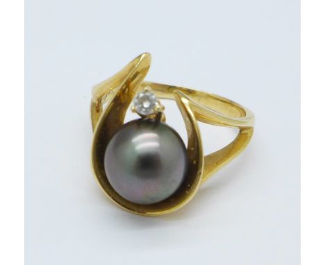 A 14ct gold, black pearl and diamond ring, 6.6g, P