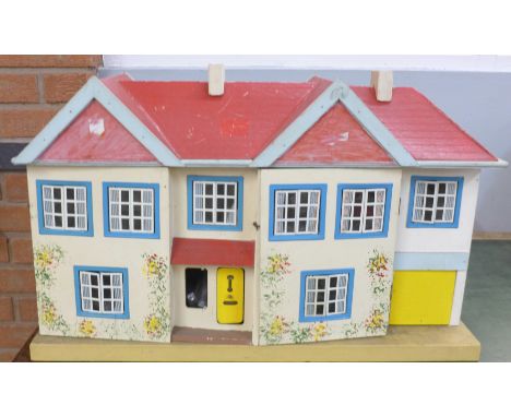 A Tri-ang dolls house with accessories and lighting